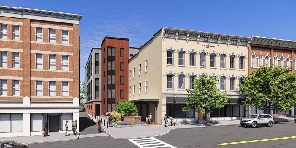 This rendering depicts what the former Hastings shop (white building) at 45 South Pleasant St. would look like when redeveloped into an Amherst College bookstore in the front and a five-story mixed-use building in the back, replacing an old brick ell.