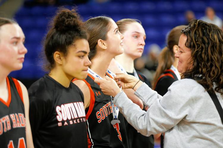 South Hadley’s Maddie Soderbaum receives a finalist medal after the MIAA Div. 4 girls basketball state final against Cathedral on Sunday afternoon at the Tsongas Center in Lowell.