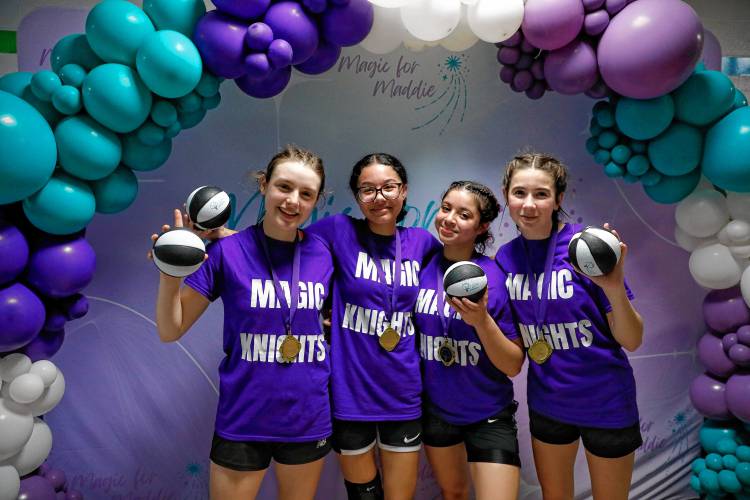 From left, Magic Knights players Olivia Athas, Aliana Almodovar, Yami Perez and Grace Sherman pose for a team photo after winning the seventh and eighth grade girls championship during the second annual Magic for Maddie 3v3 Basketball Tournament to benefit the Maddie Schmidt Memorial Scholarship on Saturday at the William E. Norris School in Southampton.