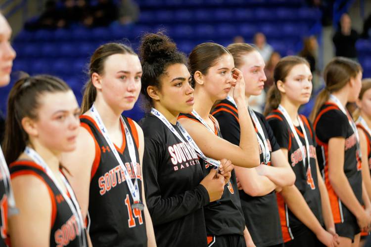 South Hadley players receive their finalist medals after the MIAA Div. 4 girls basketball state final against Cathedral on Sunday afternoon at the Tsongas Center in Lowell.