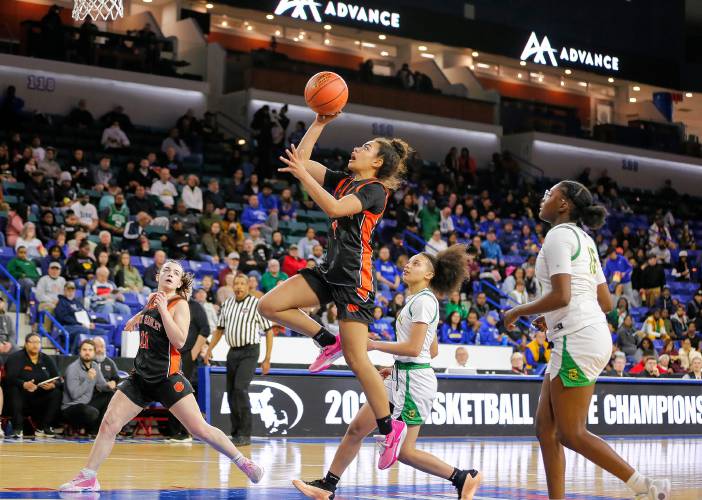 South Hadley’s Drew Alley (1) drives to the hoop for a layup against Cathedral in the third quarter of the MIAA Div. 4 girls basketball state final Sunday afternoon at the Tsongas Center in Lowell.
