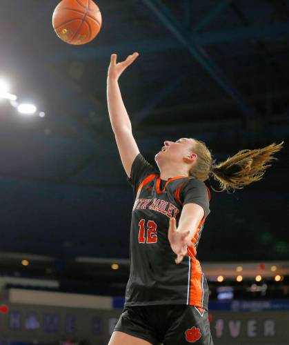 South Hadley’s Cara Dean (12) puts in a breakaway layup against Cathedral in the third quarter of the MIAA Div. 4 girls basketball state final Sunday afternoon at the Tsongas Center in Lowell.