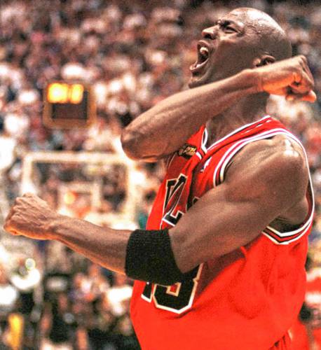 The Chicago Bulls’ Michael Jordan celebrates after winning Game 6 of the NBA Finals against the Utah Jazz on June 19, 1984.