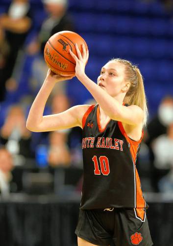 South Hadley’s Ava Asselin (10) hits a three-pointer against Cathedral in the first quarter of the MIAA Div. 4 girls basketball state final Sunday afternoon at the Tsongas Center in Lowell.