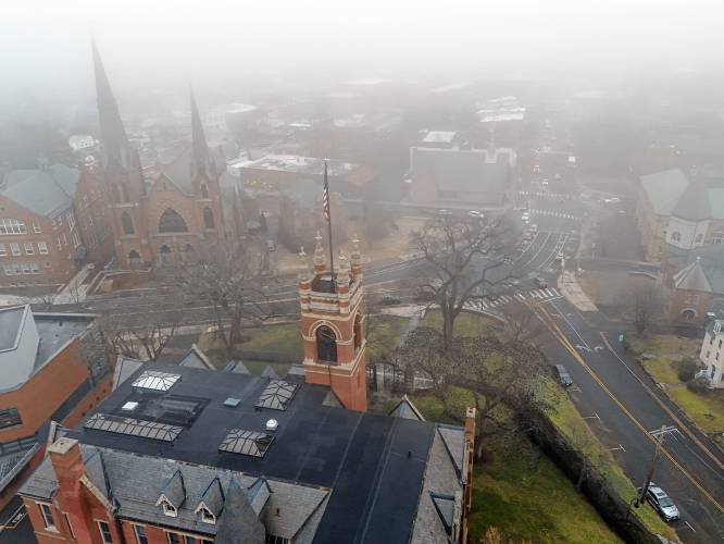 Fog rolls in over downtown Northampton overlooking College Hall on the Smith College campus.