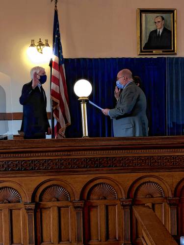 Hampshire Probate and Family Court Register Michael J. Carey being sworn in by Clerk of Courts Harry Jekanowski in 2021.