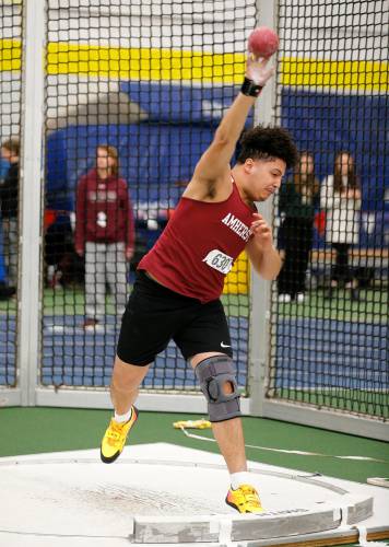 Amherst’s Nathan Oliver competes in the shot put with second place throw of 39-04.00 during the PVIAC indoor track meet Wednesday at Smith College in Northampton.