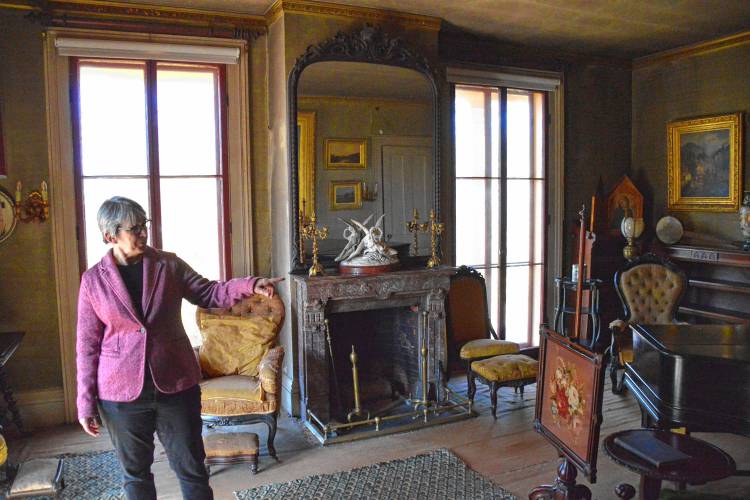 Jane Wald, executive director of the Emily Dickinson Museum, describes some of the 19th century furnishings and decor in the parlor of The Evergreens. 