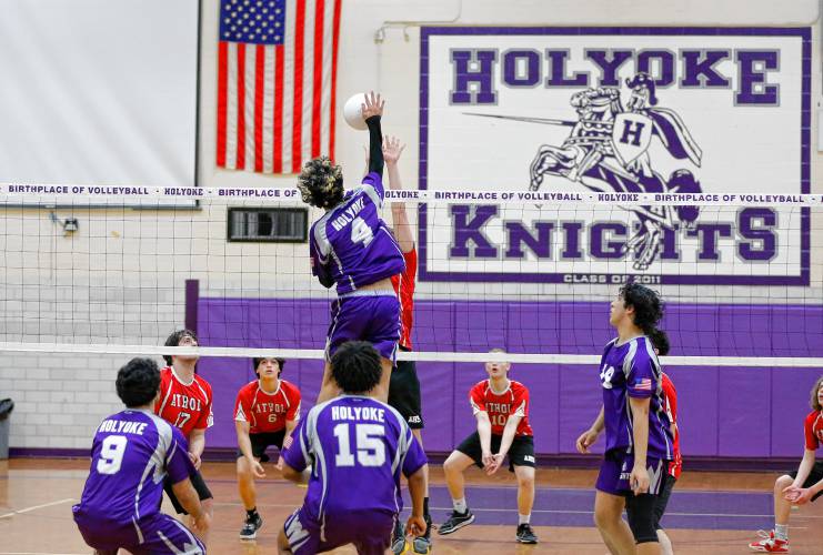 Holyoke’s Adrian Centeno-Feliciano (4) hits at the net against Athol in the second set Friday in Holyoke.