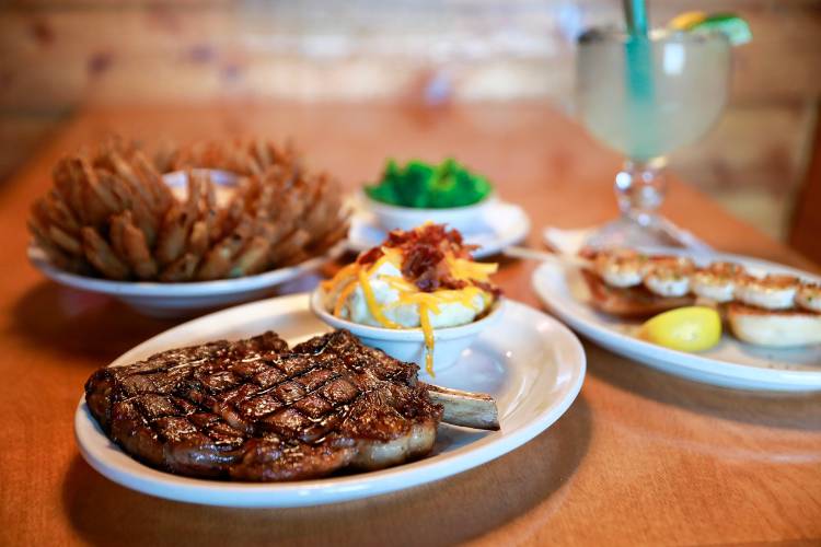 The bone-in ribeye steak with loaded mashed potatoes at Texas Roadhouse in Hadley.