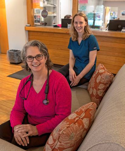 Dr. Kate Atkinson and Sofie Thiel, a medical assistant, in the reception area of Atkinson Family Practice. Thiel will be part of the medical team in the optional concierge program at Atkinson Family Practice.