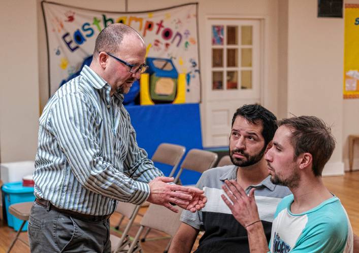 Director Jason Rose-Langston, left, makes a point with Jay Torres and David DiRocco during a rehearsal of Easthampton Theater Company’s “Torch Song” at the parish hall of St. Philip’s Episcopal Church in Easthampton.