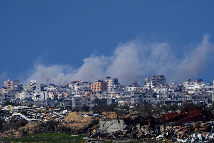 Smoke rises following an Israeli bombardment in the Gaza Strip, as seen from southern Israel, on Sunday, Feb. 4.
