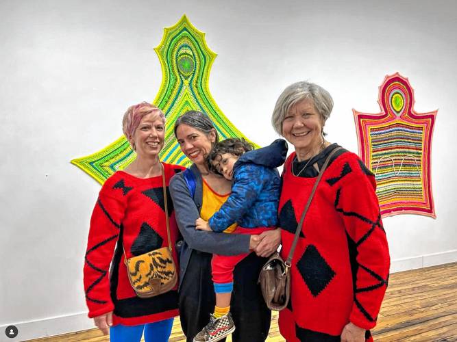 Sisters Lisa and Janelle Iglesias, from left, and their mother, Bodhild Brendryen Iglesias, are seen at PULP Gallery in Holyoke, where some of the collaborative fabric art from all three women is on view.