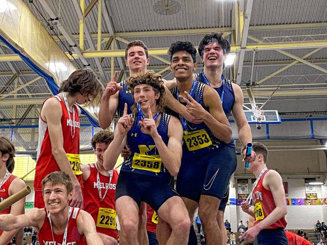 The Northampton boys’ 4x400 meter relay team celebrates on the podium after winning the state title at Saturday’s MIAA Division 3 Indoor Track and Field Championships at the Reggie Lewis Center in Boston.