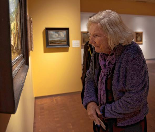 Jeanne Matera looks at a painting during a Smith College Museum of Art visit on Tuesday.