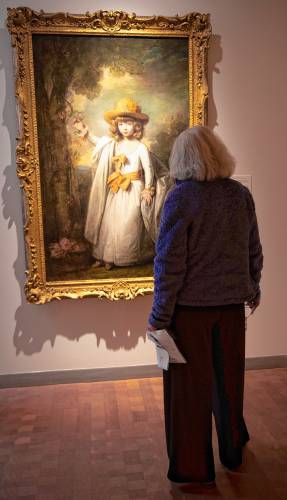 Jeanne Matera looks at painting while visiting the Smith College Museum of Art on Tuesday.