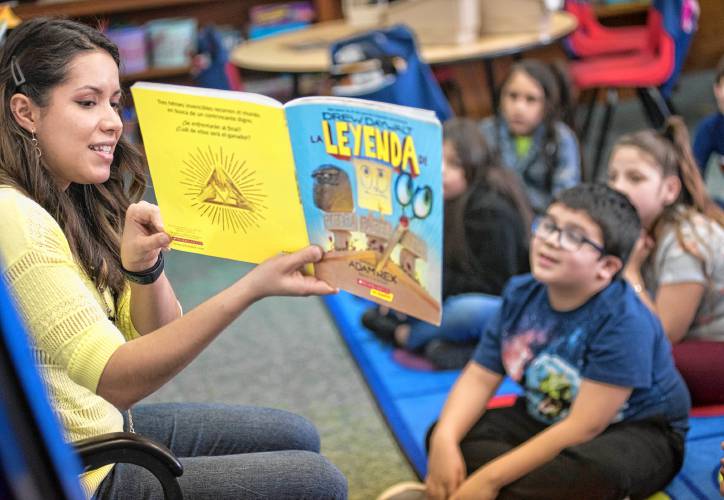 Joseph Metcalf School teacher Cynthia Gerena reads “La Leyenda de Piedra Papel Tijeras,” by Drew Daywalt, to her third grade class during a read aloud session at the dual language elementary in Holyoke on Friday, March 6, 2020.
