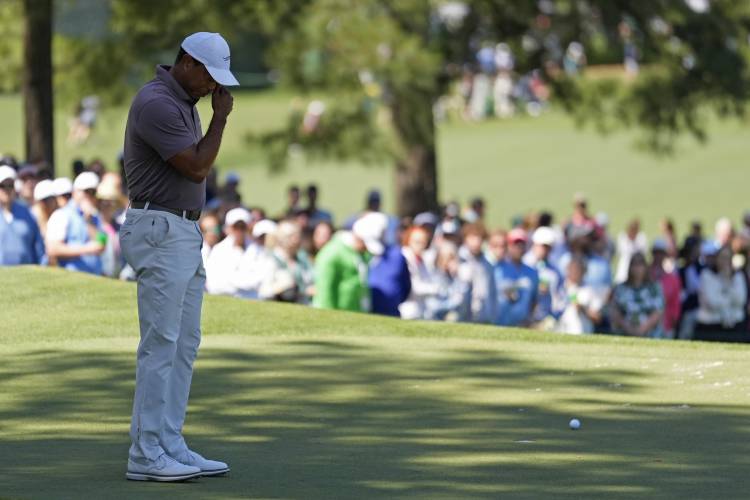 Tiger Woods reacts after missing a putt on the seventh hole during second round at the Masters golf tournament at Augusta National Golf Club Friday, April 12, 2024, in Augusta, Ga. (AP Photo/Ashley Landis)