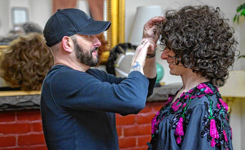 Wig and hair designer Jason P. Hayes, left, adjusts a wig for Patric Madden during a rehearsal for Easthampton Theater Company’s production of “Torch Song.”