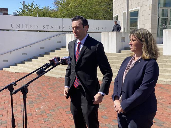 Attorney Jared Olanoff and former Chicopee schools superintendent Lynn Clark speak to reporters April 27, 2022, outside the federal courthouse in Springfield.