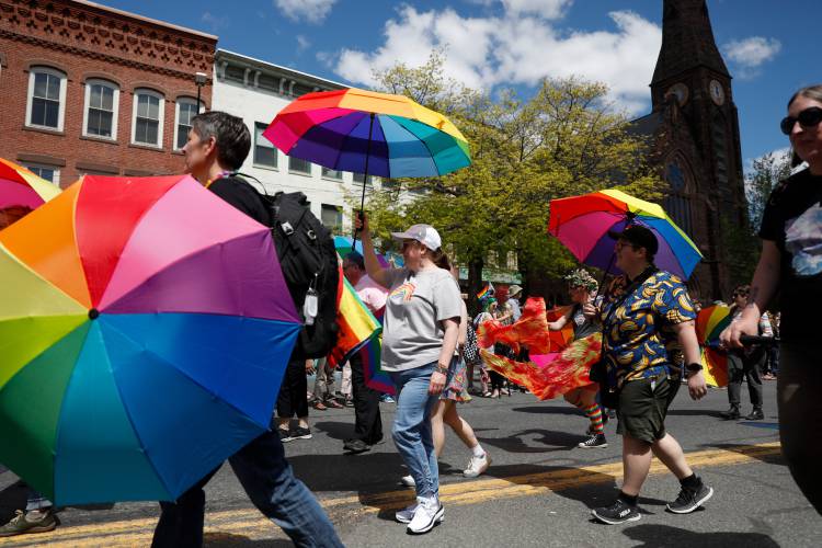 Members of the Parasol Patrol march down Main Street during the Hampshire Pride Parade in downtown Northampton on May 6, 2023. This will be the second year the Pride event is being run by Hampshire Pride.