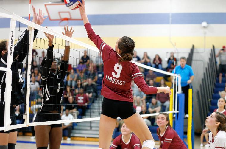 Amherst’s Ruby Austin (9) tips the ball against Longmeadow in the fourth set of the Western Massachusetts Class A girls volleyball final Saturday at Chicopee Comp.