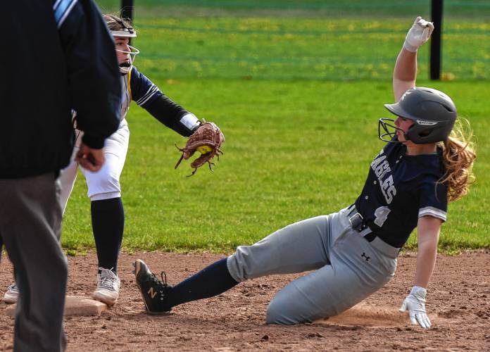 Franklin Tech’s Cordelia Guerin (4) slides safely into second base against Hopkins Academy on Friday in Turners Falls.