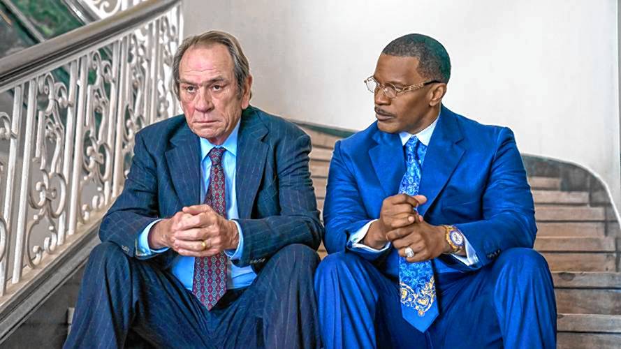 Tommy Lee Jones, as Jeremiah O’Keefe, and Jamie Foxx as his lead attorney, Willie Gary, in a scene from “The Burial.”