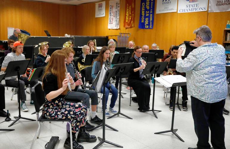 Bombyx Brass Collective Music Director Margaret Reidy conducts the South Hadley High School band during class Tuesday at the high school.