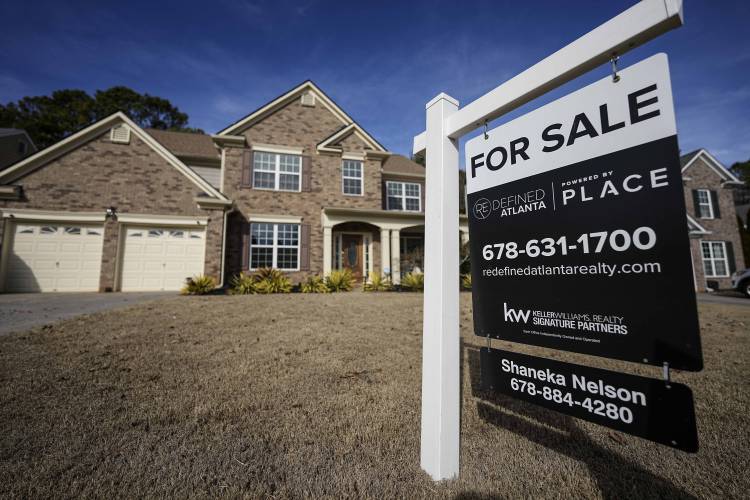 A sign announcing a home for sale near Atlanta.