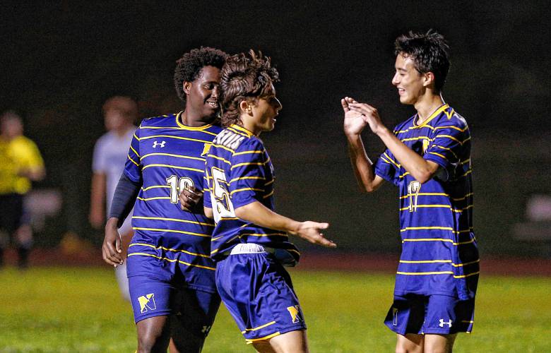 Northampton’s Sam Busone (25), middle, celebrates a first half goal against Monson with Rhys MacLachlan (17), right, and Minti Peterson (10) earlier this season.