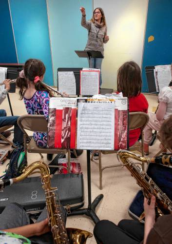 Ariel Templeton, a music teacher for the Amherst elementary schools, teaches band at Wildwood on Wednesday afternoon.
