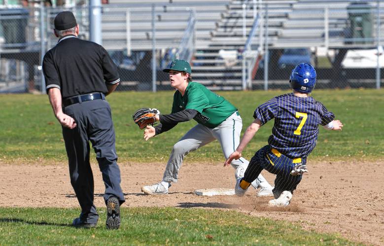 Greenfield’s Arthur Fitzpatrick waits for the throw  as Hopkins Academy’s Chace Earle takes second at Veterans Field on Tuesday. 