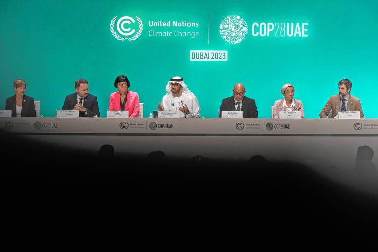 COP28 President Sultan al-Jaber, center, speaks during a news conference at the COP28 U.N. Climate Summit, Friday, Dec. 8, 2023, in Dubai, United Arab Emirates. 