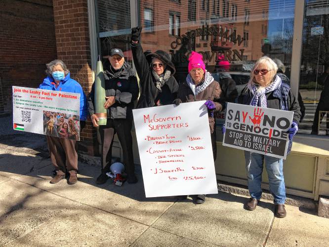 From left, Jeanne Allen, Nick Mottern, Teresa Turner, Paki Wieland and Priscilla Lynch picket ate Rep. Jim McGovern’s Northampton office on Friday.