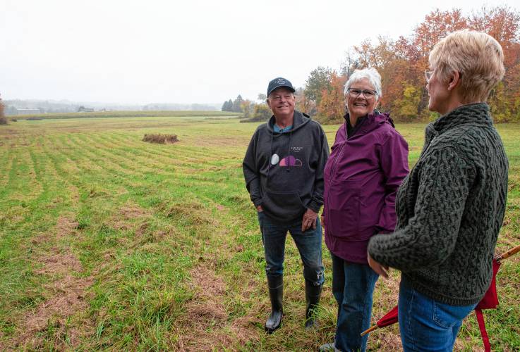 Ed and Mary Hamel, owners of Glendale Ridge Vineyard in Southampton, and Cindy Palmer, chair of the town’s Open Space Committee, on a portion of the 80 acres the Hamels are placing in a conservation restriction. 