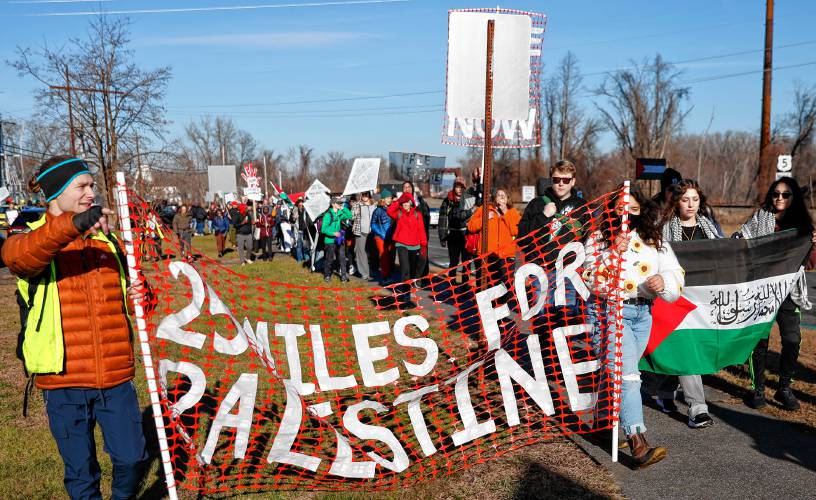 Hundreds of marchers make their way from the Manhan Rail Trail in Easthampton onto Route 5 toward Holyoke during the 25 Mile March for Palestine on Saturday, Dec. 16.