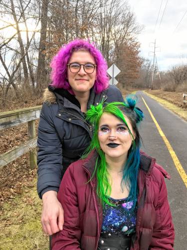 Nonbinary couple Maya Shaffer, standing, and partner Storm Truman exploring the Manhan Rail Trail on the eve of the region’s first big snowstorm earlier this month.  