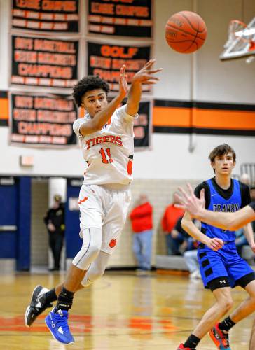 South Hadley’s Isiah James (11) dishes a pass against Granby in the fourth quarter Wednesday night in South Hadley.