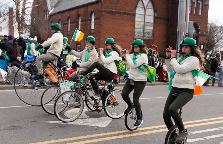 The Cycling Murrarys make their way down Northampton Street during  Holyoke St. Patrick’s Day Parade last year. This year’s parade will kick off Sunday morning at 11:10 a.m.