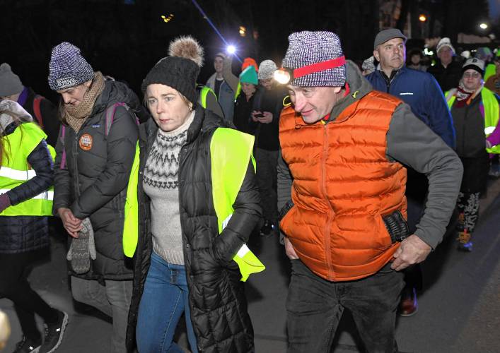 Gov. Maura Healey walks with Andrew Morehouse, executive director of the Food Bank of Western Massachusetts, on the final leg of the march, from Deerfield Academy to Greenfield.