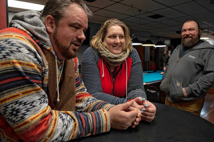 Donald Carberry, a co-sponsor for the arm wrestling event The Pulaski Pull Down, Rose Lynch and Chris Parker at Se7ens Sports Bar and Grill in Easthampton Dec. 6.