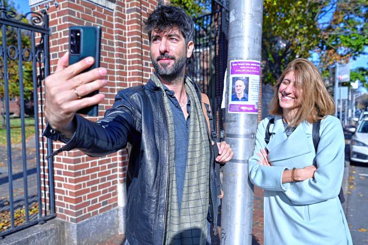 Peace activists Alon-Lee Green, who is Jewish, and Sally Abed, a Palestinian Israeli, take a selfie Nov. 15 at Harvard University in Cambridge.