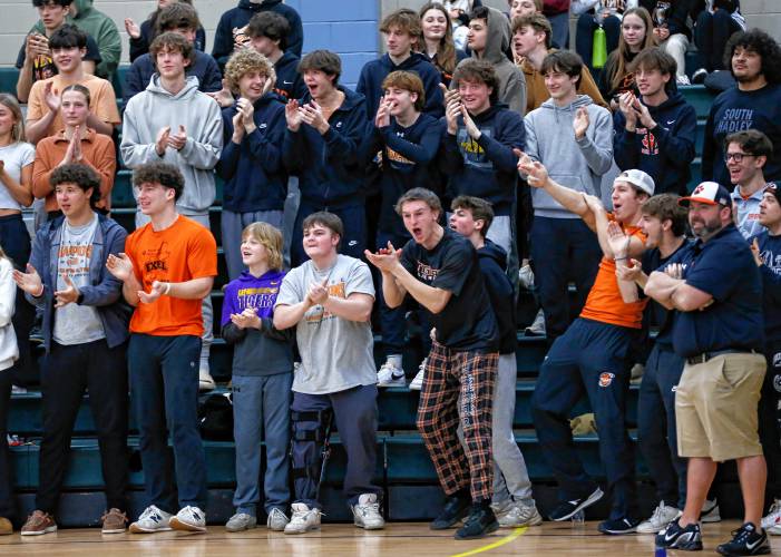 South Hadley girls basketball fans cheer in the third quarter against Pittsfield during the Western Mass. Class B championship last month at Holyoke Community College.