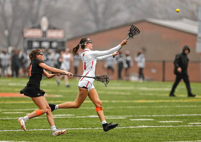 South Hadley’s Emily Pilligian (4) sends a pass against Belchertown in the fourth quarter Thursday in South Hadley.