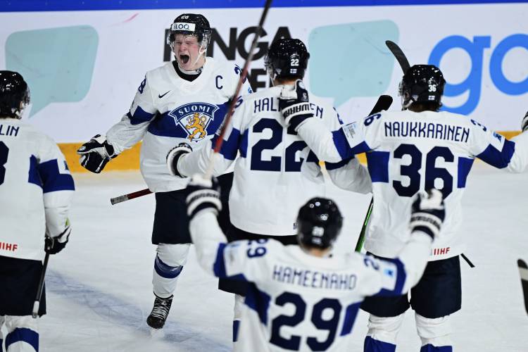 Finland's Jere Lassila celebrates after scoring his side's fourth goal during the in IIHF World Junior Championship ice hockey quarter final match between Slovakia and Finland at Froelundaborg in Gothenburg, Sweden, Tuesday, Jan. 2, 2024. (Bjoern Larsson Rosvall/TT News Agency via AP)
