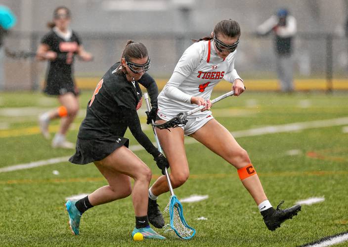 Belchertown’s Madison DaCosta (8) and South Hadley’s Emily Piligian (4) fight for possession in the third quarter Thursday in South Hadley.
