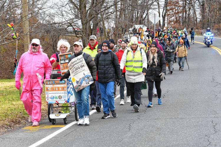 The March for the Food Bank with Monte Belmonte, second from left, makes its way up North Main Street in South Deerfield on its way to Greenfield, raising money and awareness for the Western Massachusetts Food Bank.