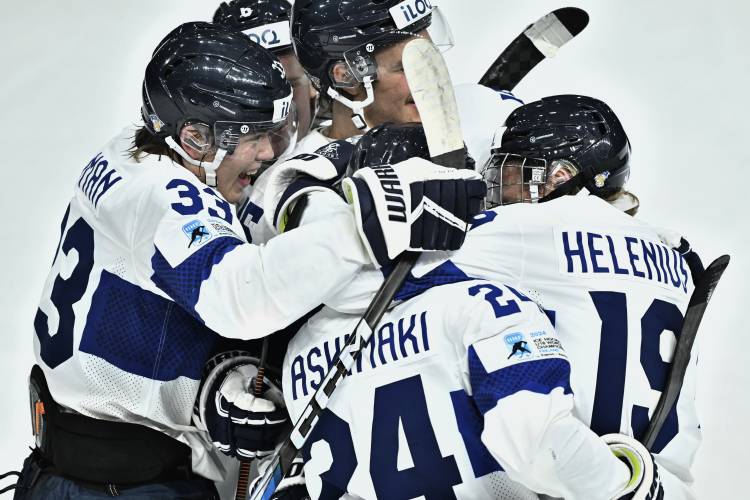 Finland's players celebrate their side's third goal during the in IIHF World Junior Championship ice hockey quarter final match between Slovakia and Finland at Froelundaborg in Gothenburg, Sweden, Tuesday, Jan. 2, 2024. (Bjoern Larsson Rosvall/TT News Agency via AP)